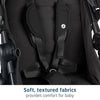 Maxi-Cosi Zelia Luxe 5-in-1 modular travel system with stroller, car seat, and accessories in stylish fabric.