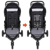 Pink Baby Trend Passport cargo stroller with EZ-Lift Plus infant car seat, featuring bamboo accents and adjustable handlebar.