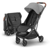 UPPAbaby Minu V3 travel stroller in Greyson color, lightweight, compact design with one-hand fold, suitable from birth, with saddle leather accents.