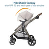 Maxi-Cosi Zelia Luxe 5-in-1 travel system with stroller and car seat, featuring adjustable handle and modern design.