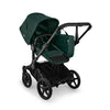 Bugaboo Donkey 6 Cocoa Brown single-to-double all-terrain stroller with toddler and newborn seats, suitable for urban and outdoor use.