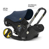 Doona all-in-one travel system with slate green car seat and stroller, compact design, and adjustable handle for convenient travel.