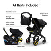 Doona all-in-one travel system with slate green car seat and stroller, showing the compact, foldable design for easy travel.