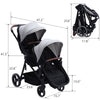 Dark grey tandem double stroller for newborn and toddler, with reversible seats, adjustable canopy, large storage, and one-hand fold.