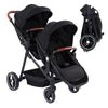Black tandem stroller with reversible seats, adjustable canopy, large storage basket, and one-hand fold for twins and newborns.