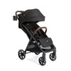Joie Nutmeg compact stroller in shale color, lightweight design with one-hand fold, suitable for easy travel and daily use.