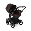 Bugaboo Donkey 6 Cocoa Brown single-to-double all-terrain stroller with toddler seat and bassinet, suitable for newborns and toddlers.