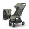 UPPAbaby Minu V3 lightweight travel stroller in Greyson with charcoal frame, saddle leather accents, showing folded and unfolded views