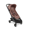 Black Bugaboo Butterfly 2 travel stroller with ultra-compact fold, lightweight design, suitable for airplane travel, shown folded.