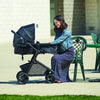 Evenflo Pivot Modular Travel System with SafeMax Car Seat, stroller with car seat attached, featuring adjustable handle and storage basket.